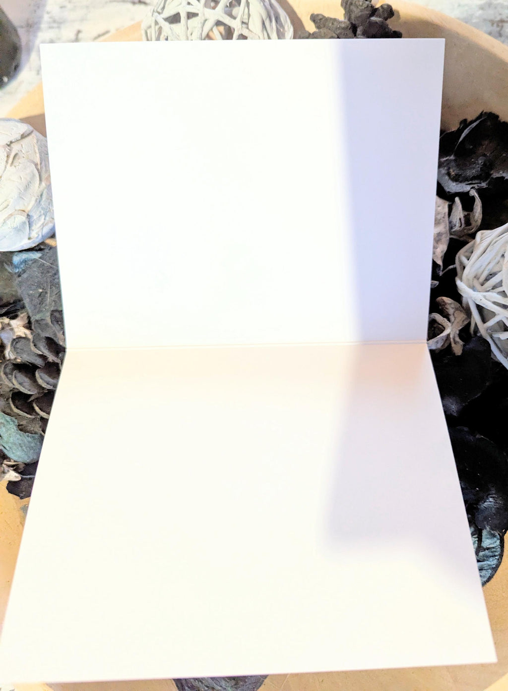 White paper on a surface with decorative elements