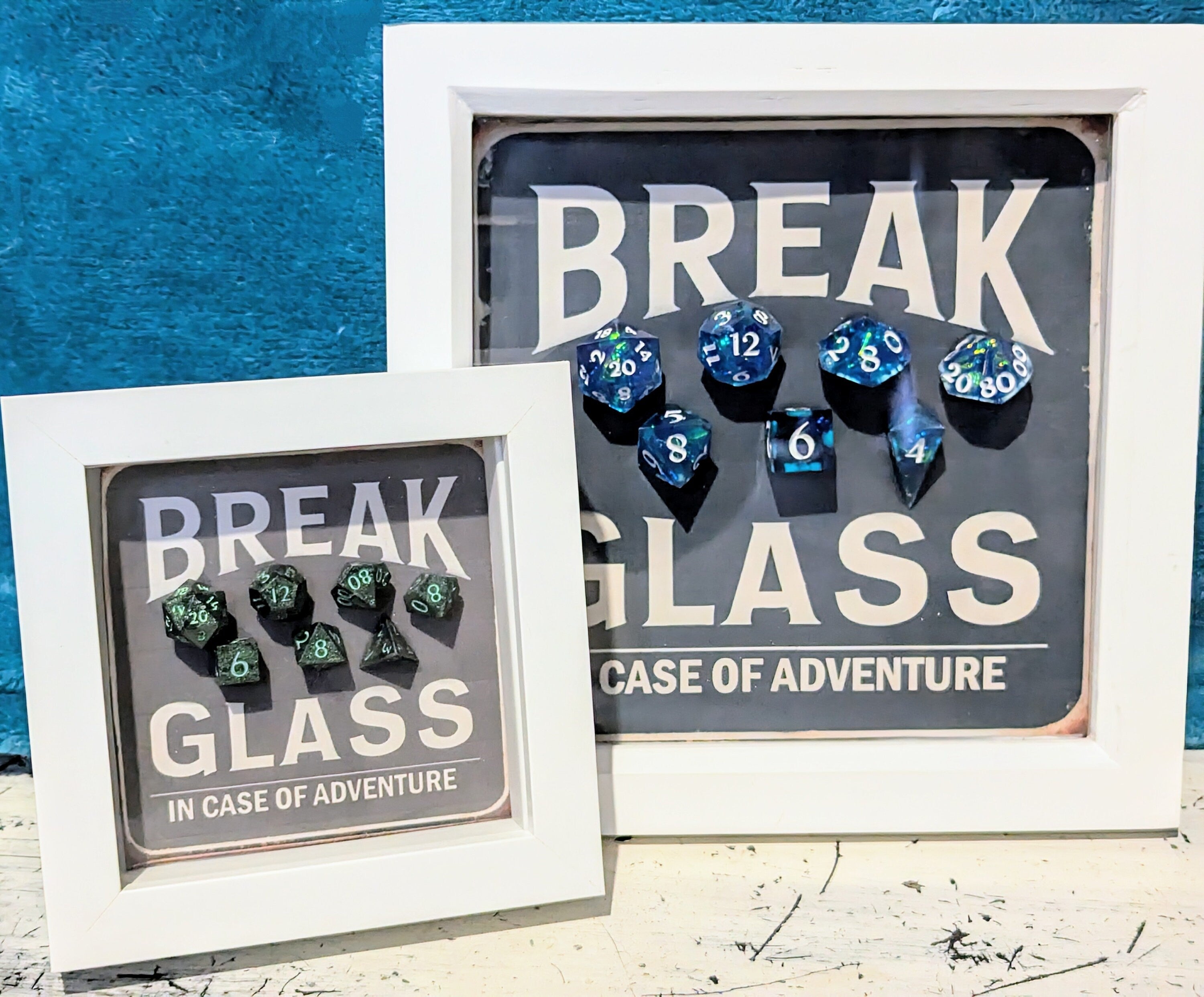 Wall Art Box Frame that has a vintage sign style background and says Break Glass in case of Adventure with a set of 7 polyhedral Dice inside.