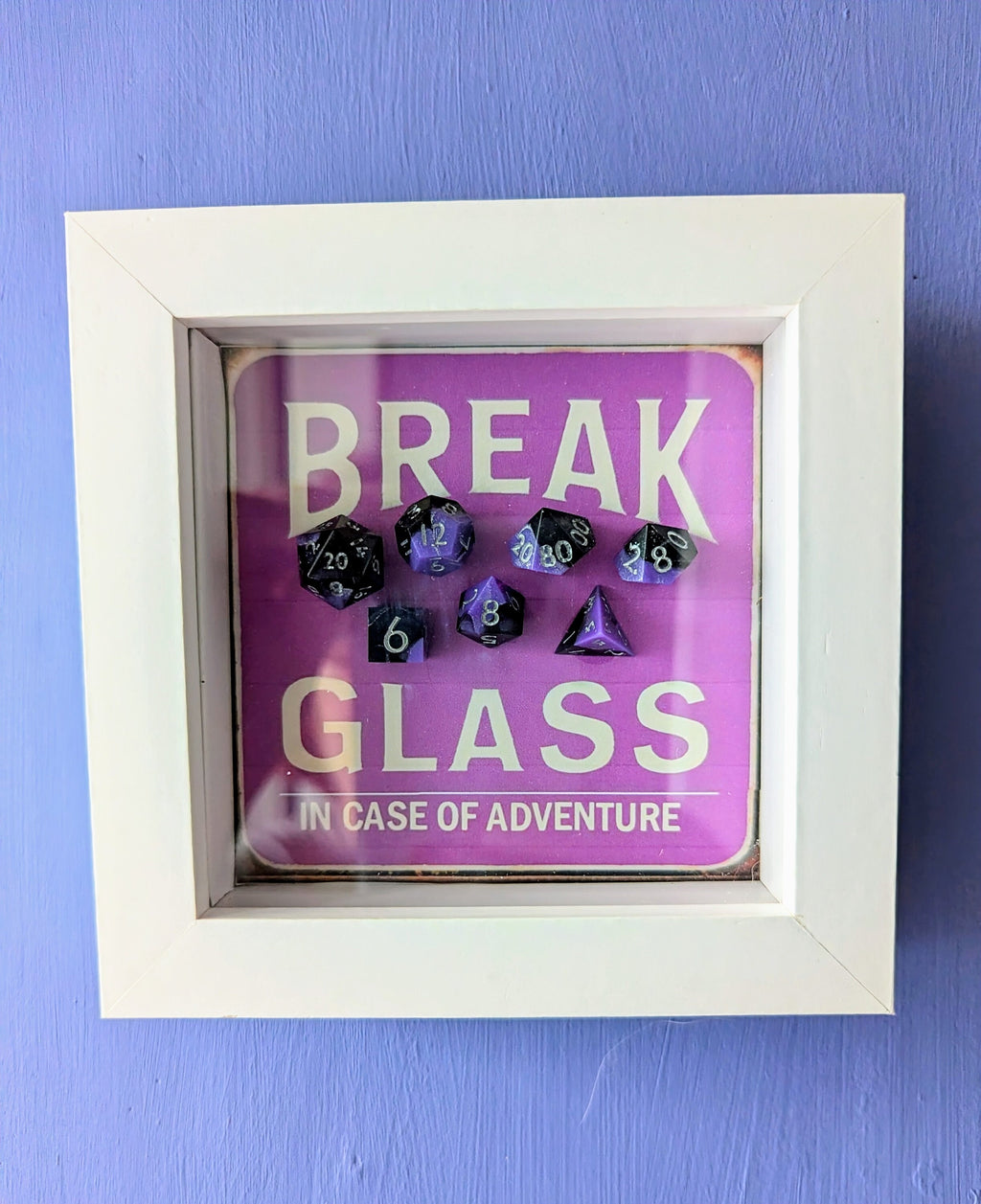 Wall Art Box Frame that has a vintage sign style background and says Break Glass in case of Adventure with a set of 7 polyhedral Dice inside.