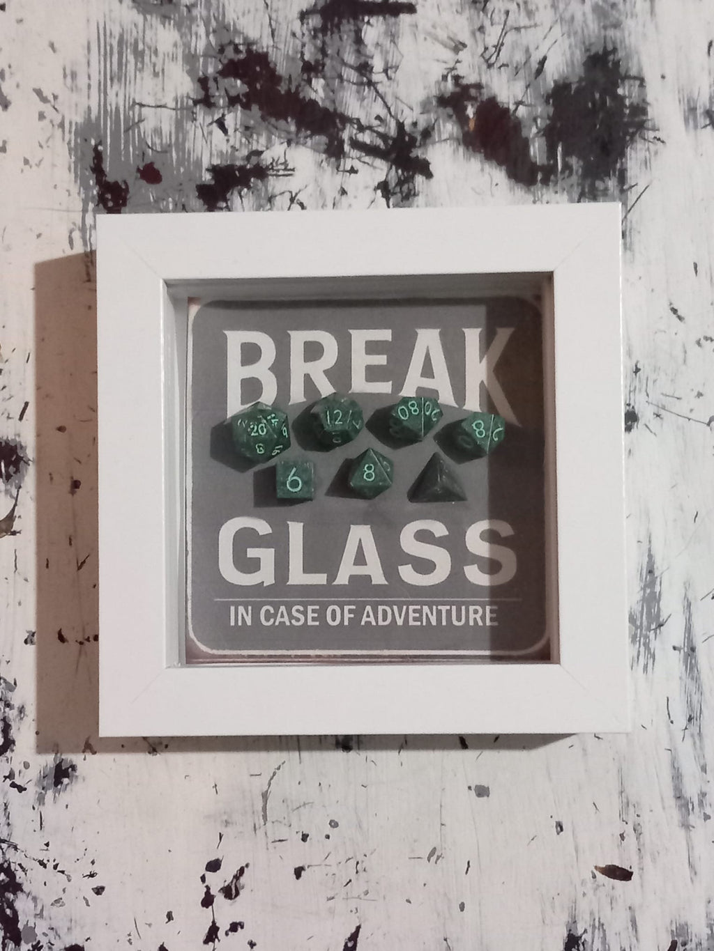 Wall Art Box Frame that has a vintage sign style background and says Break Glass in case of Adventure with a set of 7 polyhedral Dice inside.