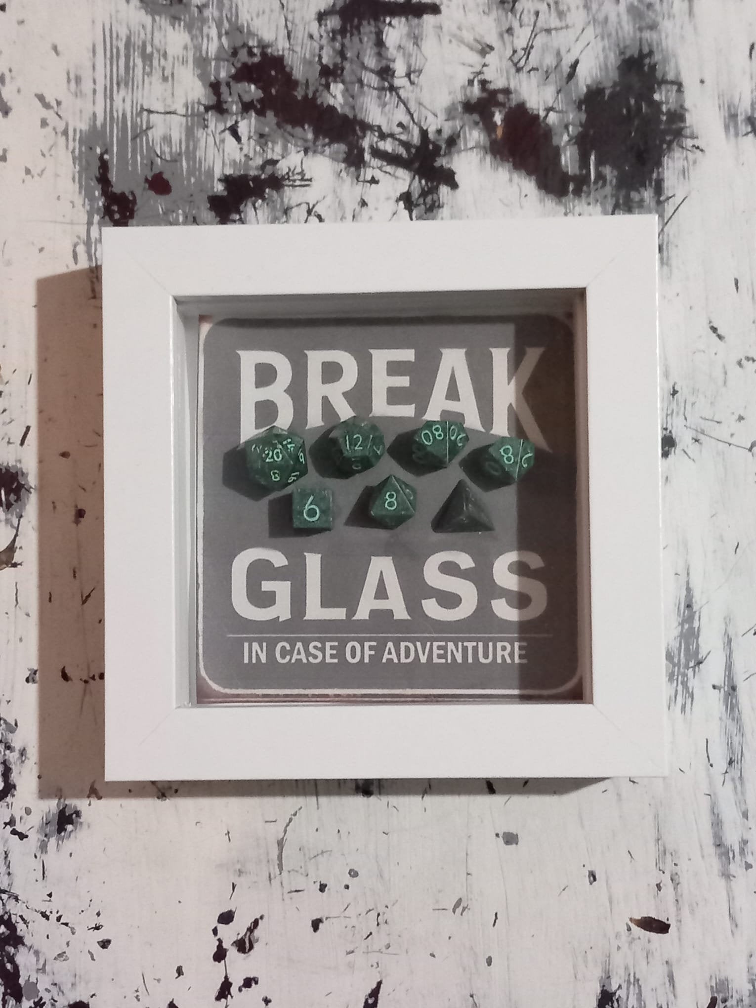 Wall Art Box Frame that has a vintage sign style background and says Break Glass in case of Adventure with a set of 7 polyhedral Dice inside.
